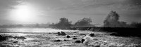 Framed Waves breaking on rocks in the ocean in black and white, Oahu, Hawaii