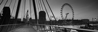 Framed Bridge across a river with a ferris wheel, Golden Jubilee Bridge, Thames River, Millennium Wheel, London, England