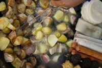 Framed Fried potatoes and snacks on the grill in a street market, Old Town, Lijiang, Yunnan Province, China