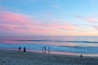 Framed Tourists on the beach at sunset, Santa Monica, California, USA