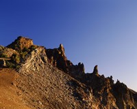 Framed Hillman Peak crags at sunrise, Crater Lake National Park, Oregon, USA