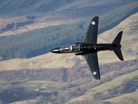 Framed Hawk T1 trainer aircraft of the Royal Air Force low flying over North Wales