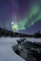 Framed Aurora Borealis over the Blafjellelva River in Troms County, Norway