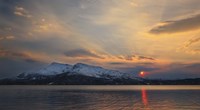 Framed Midnight Sun over Tjeldsundet strait in Troms County, Norway