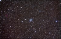 Framed Open cluster NGC 457 in the constellation Cassiopeia