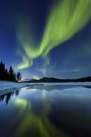Framed Aurora Borealis over Sandvannet Lake in Troms County, Norway