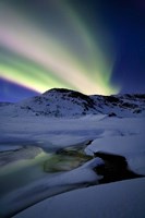 Framed Aurora Borealis over Mikkelfjellet Mountain in Troms County, Norway