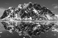 Framed Antarctica, Mountain peaks reflected in the Lemaire Channel.