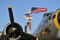 Framed 1940's style majorette pin-up girl on a B-17 bomber with an American flag