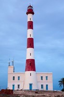 Framed Taguermes Lighthouse at dawn, Sidi Mahres Beach, Jerba Island, Tunisia