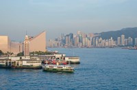 Framed Kowloon ferry terminal and clock tower, Hong Kong, China