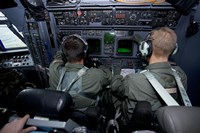 Framed Airmen at Work in a MC-130H Combat Talon II