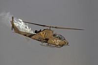 Framed AH-1S Tzefa of the Israeli Air Force dispenses flares