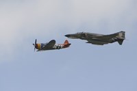 Framed P-47 Thunderbolt and an F-4 Phantom in Flight