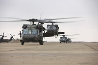 Framed UH-60 Black Hawks taxis out for a mission over northern Iraq