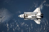 Framed Aerial view of Space Shuttle Discovery over Earth