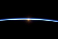 Framed Thin line of Earth's Atmosphere and the Setting Sun