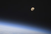Framed Gibbous Moon Visible above Earth's Atmosphere