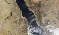 Framed Dust plumes blow off the coast of Saudi Arabia and over the Red Sea