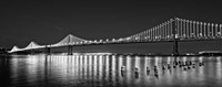 Framed Bay Bridge lit up at night, San Francisco, California