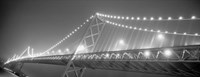 Framed Suspension bridge lit up at night, Bay Bridge, San Francisco, California