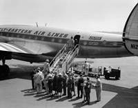 Framed 1950s Group Of Passengers Boarding Airplane
