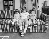 Framed 1970s Three Siblings Sitting On Couch