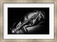 Framed Black And White Still-Life Image Of A Brass Clarinet