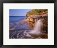 Framed Waterfall Flows Across Sandstone Shore At Miners Beach