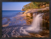 Framed Waterfall Flows Across Sandstone Shore At Miners Beach