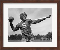 Framed Quarterback About To Toss Football Pass