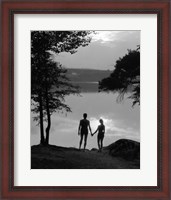 Framed Man And Woman In Bathing Suits Holding Hands Watching Sunset Lakeside