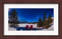 Framed Red Chairs Under a Moonlit Winter Sky at Two Jack Lake