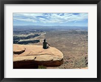 Framed Adult Male Sitting on the Edge Of a Stunning Viewpoint