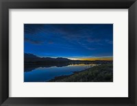 Framed Noctilucent Clouds Glowing and Reflected in Calm Waters of the Waterton River