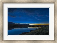 Framed Noctilucent Clouds Glowing and Reflected in Calm Waters of the Waterton River