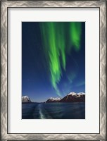 Framed Aurora Over Moonlit Peaks in the Norwegian Sea