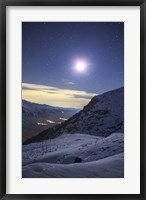 Framed Moon Above the Snow-Covered Alborz Mountain Range in Iran