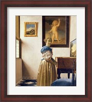 Framed Lady standing at the Virginal