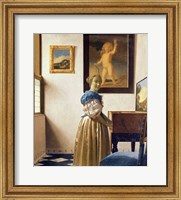 Framed Lady standing at the Virginal