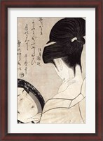 Framed Young woman applying make-up