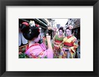 Framed Three geishas, Kyoto, Honshu, Japan (taking pictures)