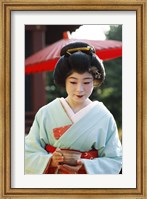 Framed Young woman dressed as a Geisha, Japan
