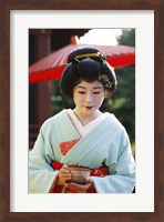 Framed Young woman dressed as a Geisha, Japan