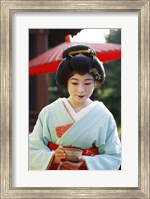 Framed Young woman dressed as a Geisha, Japan