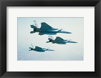 Framed Three F-15 Eagle fighter planes flying in formation