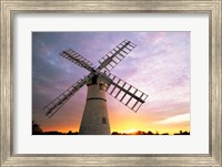 Framed Boats moored near a traditional windmill, Horsey Windpump, Horsey, Norfolk Broads, Norfolk, England