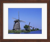 Framed Windmills along a river, Kinderdike, Amsterdam, Netherlands