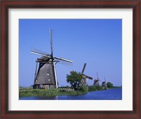 Framed Windmills along a river, Kinderdike, Amsterdam, Netherlands