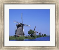 Framed Windmills along a river, Kinderdike, Amsterdam, Netherlands